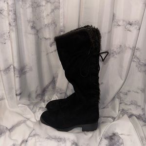 Black and grey fur lace up boots. Has a zipper on the side and a slight heel.